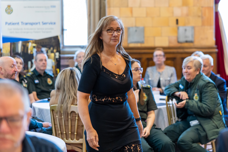 Rachel Poulton-Hartley walking towards the stage to receive her award.