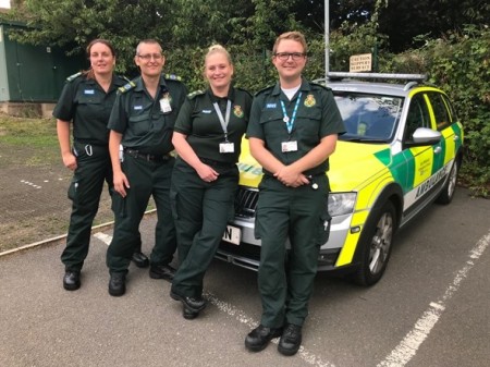 EMAS team in front of an ambulance car.jpeg