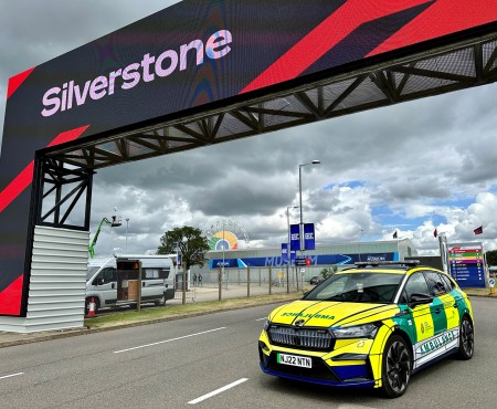 Our electric powered solo paramedic response car is positioned under the Silverstone sign at the Silverstone race track in Northamptonshire.