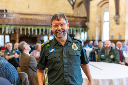 Mark Wilbourn walking towards the stage to receive his award
