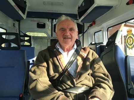 Brian Scanlon in a wheelchair in the PTS ambulance